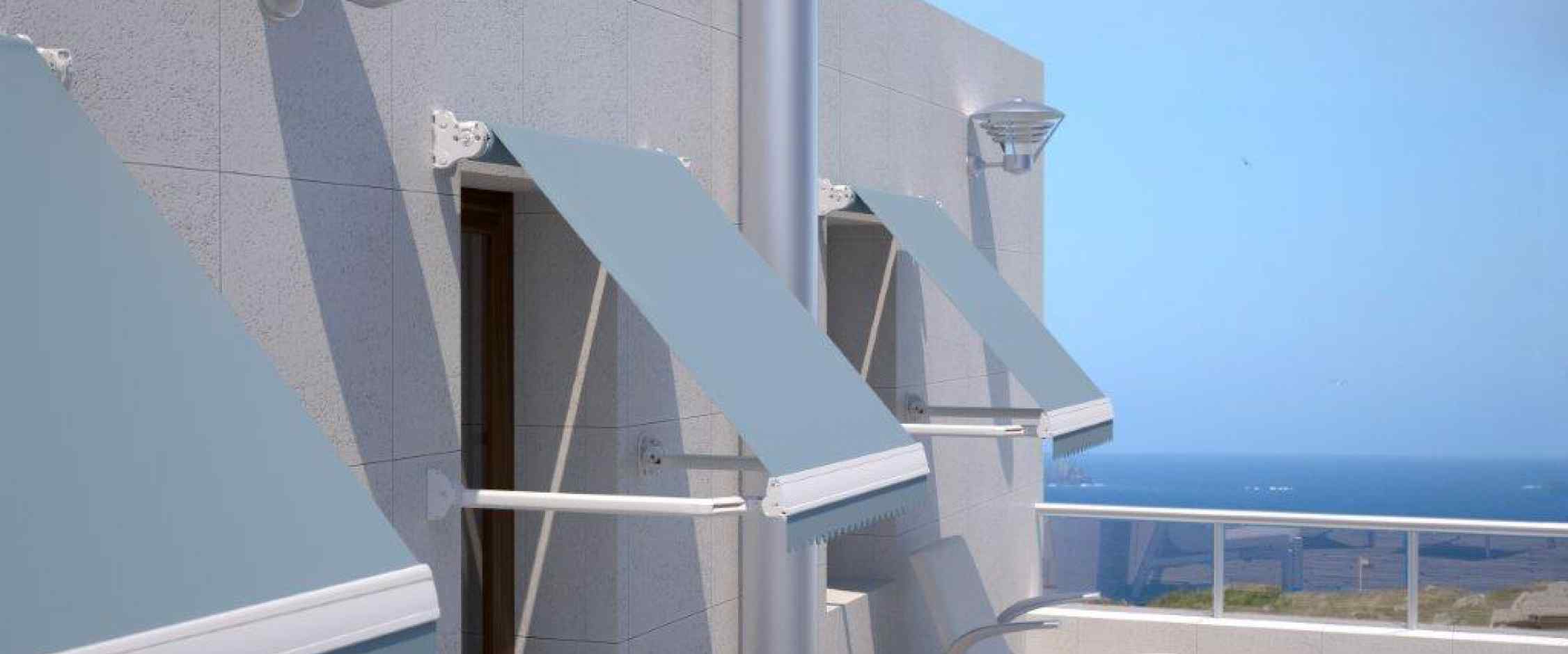 Toldo sistema brazo punto recto modelo Indico para protección solar de ventanas y sistema de brazos antiviento. Para mayor seguridad apertura y cierre mediante manivela o motor.